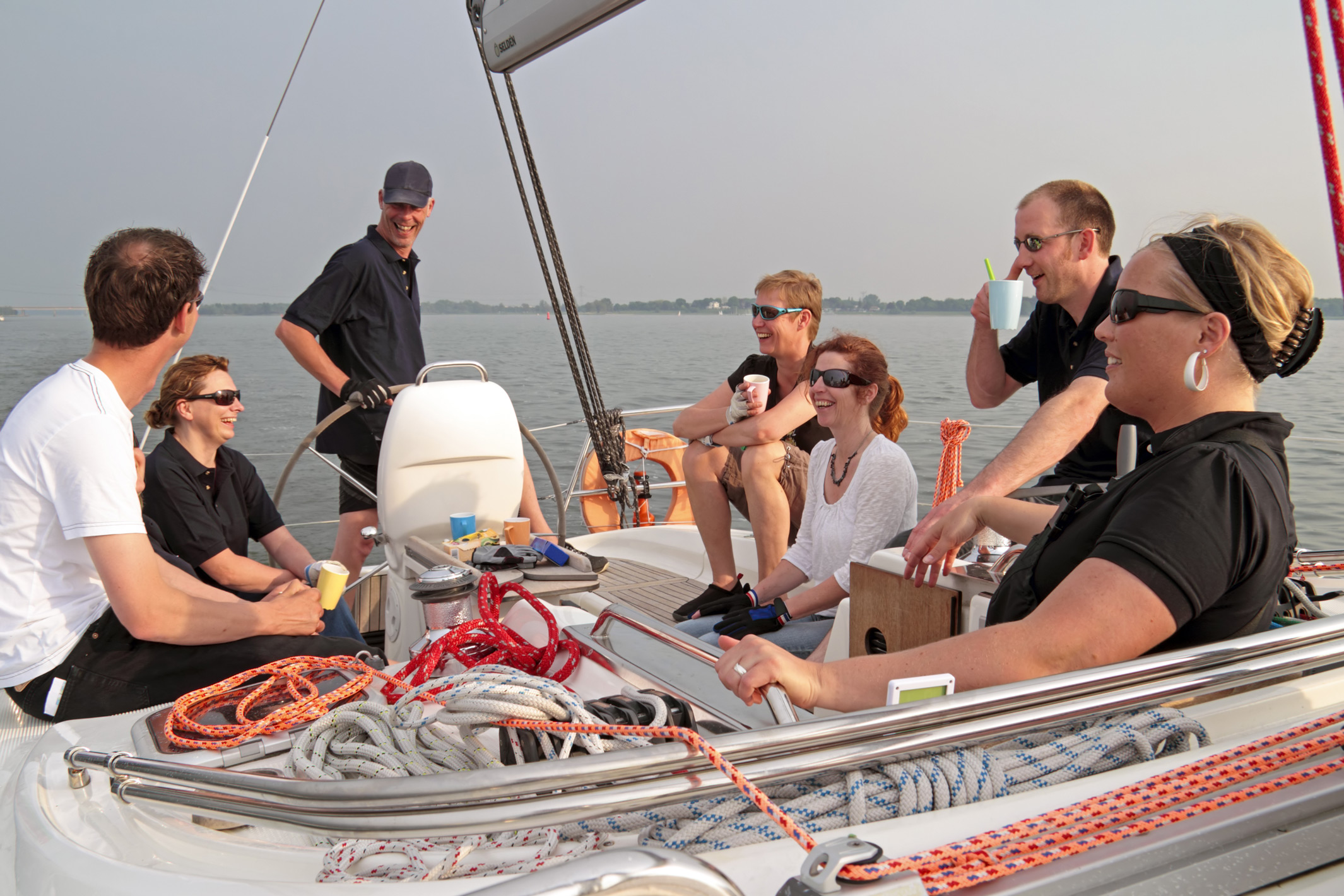 Relaxed sailing family on the Ijsselmeer in Holland